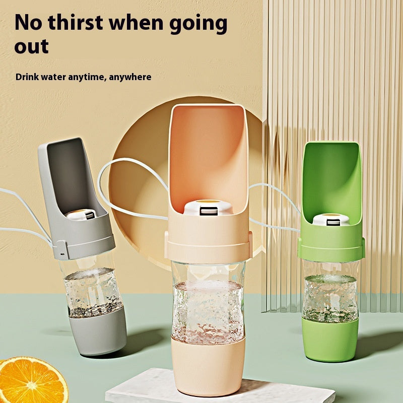 ROAM Bottle in grey, pink and green with water in the bottle