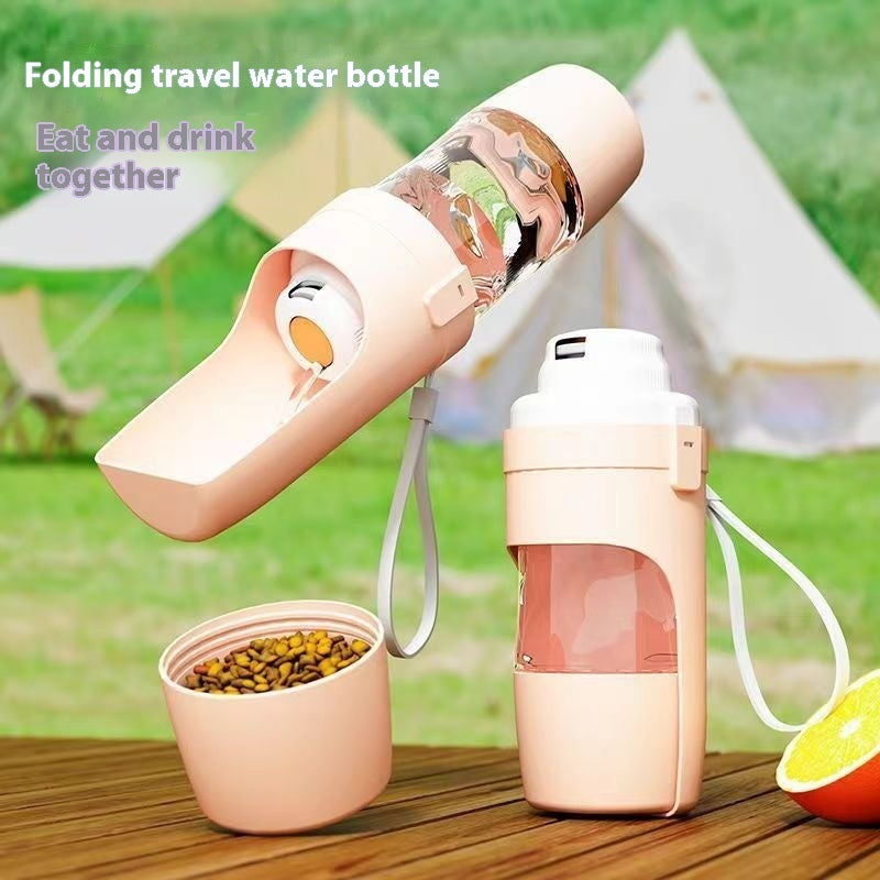 Pink ROAM Bottle with the trough open beside its food cup filled with kibble